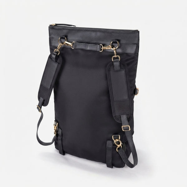Close-up of the black recycled nylon fabric on the DAKOTA convertible backpack showing high-quality durable texture.